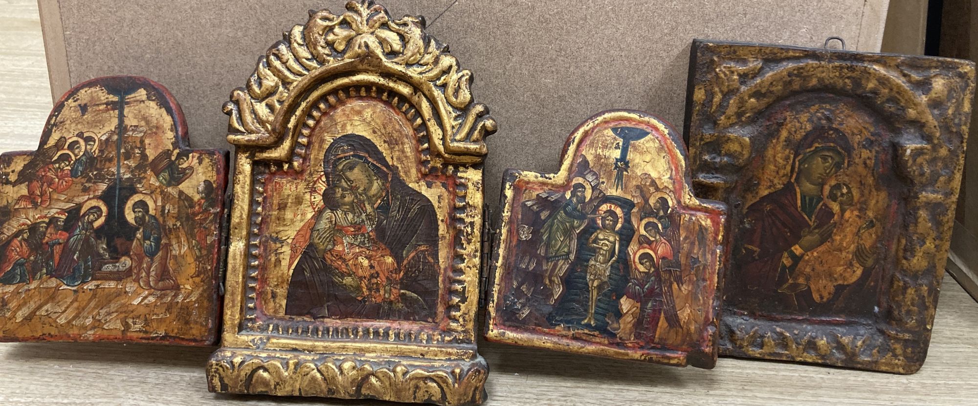 A tempera on wood triptych icon, height overall 25cm and a single Virgin and child icon, 21 x 17cm